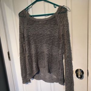 Grey knitted sweater with holes